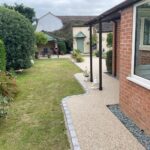 Resin bond patio and paths with brick surround