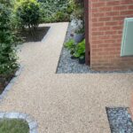 Resin bond patio and paths with brick surround